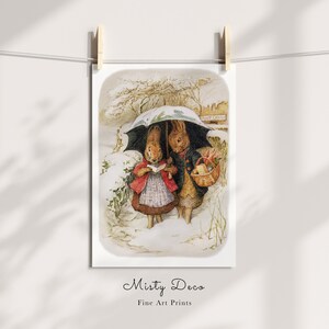 May include: Two brown rabbits walking in the snow under a green umbrella. The rabbit on the left is holding a book and the rabbit on the right is carrying a basket of flowers.