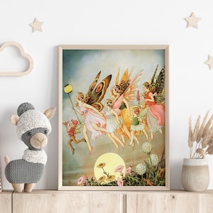May include: A framed vintage print depicts a group of fairies with butterfly wings, flying towards a large yellow sun. The fairies wear colorful dresses and are holding a lantern. The artwork is displayed on a wooden shelf.