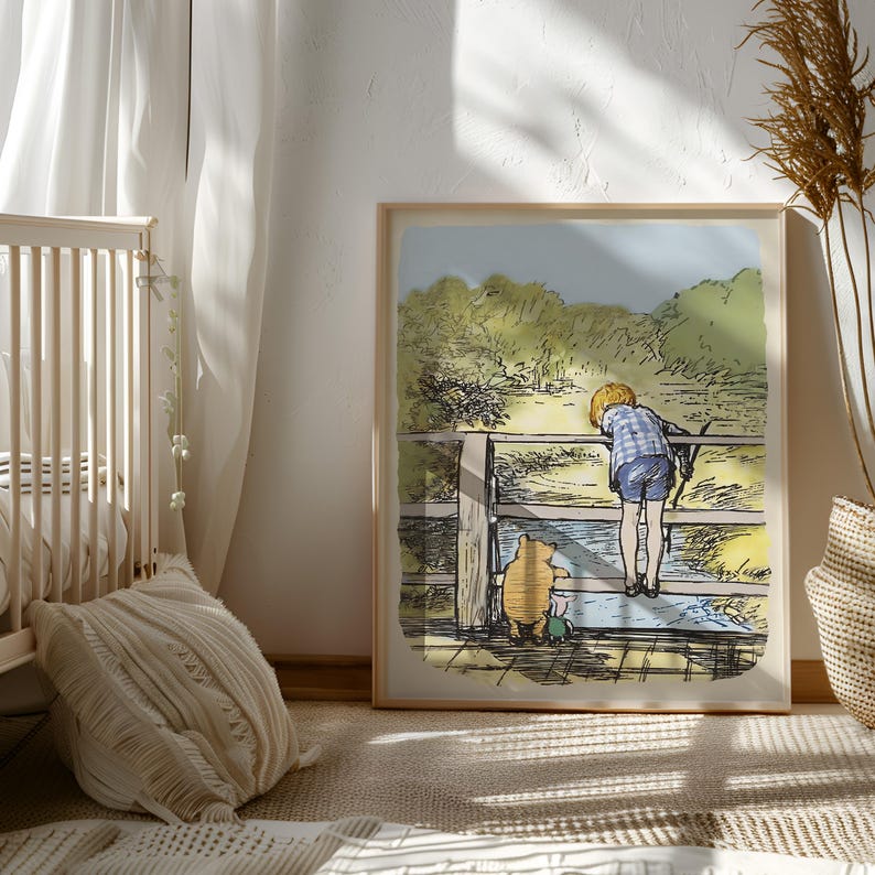 May include: A framed illustration of Winnie the Pooh and a boy standing on a wooden bridge over a stream. The boy is wearing a blue and white plaid shirt and blue shorts. Winnie the Pooh is wearing his signature red shirt and is looking at the boy.
