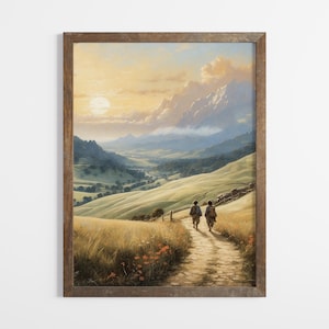 May include: A framed landscape painting depicts two figures walking along a path through a valley. The scene features rolling green hills, a distant mountain range, and a setting sun. The artwork is in a wooden frame.