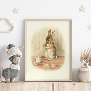 May include: A framed illustration of a brown rabbit holding a teacup, surrounded by a set of miniature teacups and saucers on a table. The rabbit is wearing a pink bow.