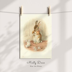May include: A vintage illustration of a brown rabbit wearing a pink bow, sitting at a table with a teacup and saucer. The rabbit is surrounded by other teacups and saucers, and there is a teapot on the table.
