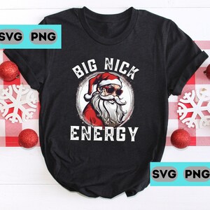 May include: Black t-shirt with a graphic of Santa Claus wearing sunglasses and the text "BIG NICK ENERGY".