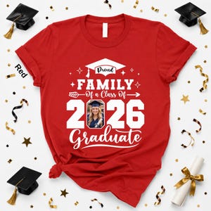 a red t-shirt with a graduation cap and tassel, surrounded by gold confetti and a graduation gown.