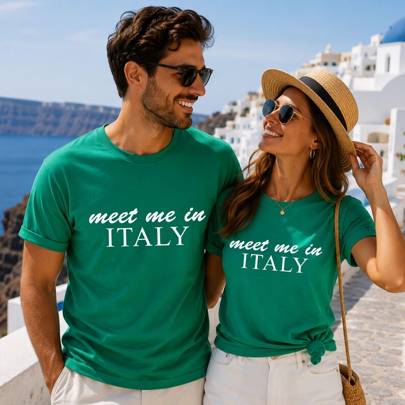 A man and a woman wearing matching green t-shirts with the text "Meet me in ITALY" are standing together and smiling.