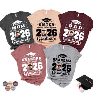 a collection of t-shirts with graduation-related text and graphics, including a variety of colors and styles.