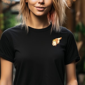 May include: A black t-shirt with a cartoon dog illustration on the left chest.