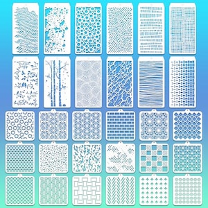 May include: A collection of white plastic stencils with various patterns, including geometric shapes, textures, and natural designs. The stencils are arranged against a gradient blue background, ideal for crafts and art projects.