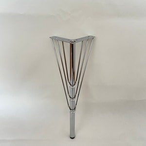 May include: A chrome corner table leg with a five-pronged base.