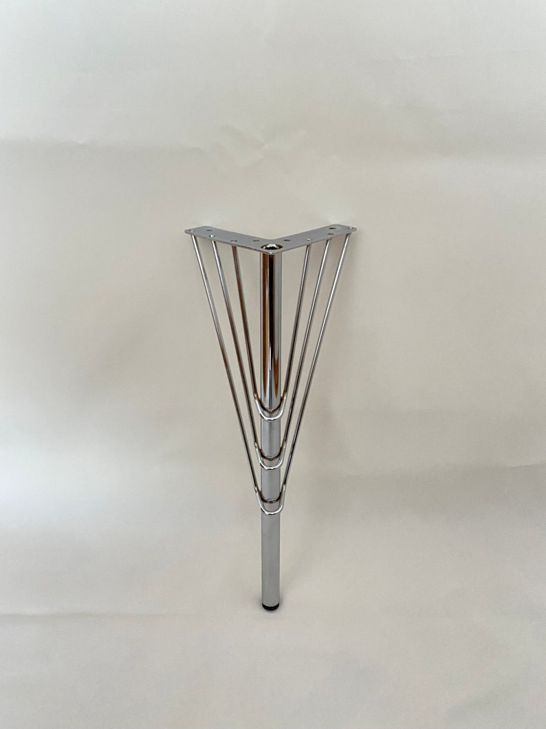 May include: A chrome corner table leg with a five-pronged base.