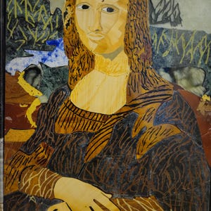 May include: A mosaic artwork depicting the Mona Lisa, created using various coloured stones and tiles. The artwork features a woman with a soft smile, wearing a dark brown dress with a yellow and brown pattern. The background is a green and brown landscape.
