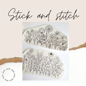 May include: Two black and white line drawings of floral designs on a white background. The designs are in the shape of a rounded rectangle. The text "Stick and stitch" is written above the images.