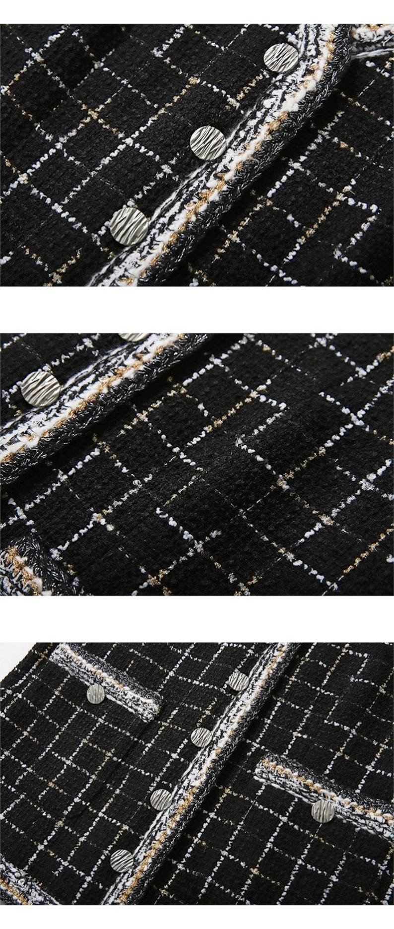 May include: Black and white tweed fabric with a subtle gold thread woven in. The fabric has a textured surface and is trimmed with a black and white fringe. There are silver buttons on the fabric.