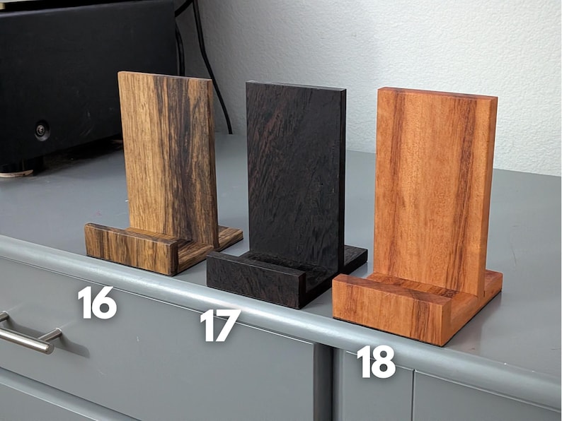 Handcrafted wooden now playing stand for vinyl records – stylish turntable accessory to display your current album in natural hardwood; perfect for audiophile decor and vinyl enthusiasts. Featuring black limba, wenge, and tigerwood. Numbered 16-18