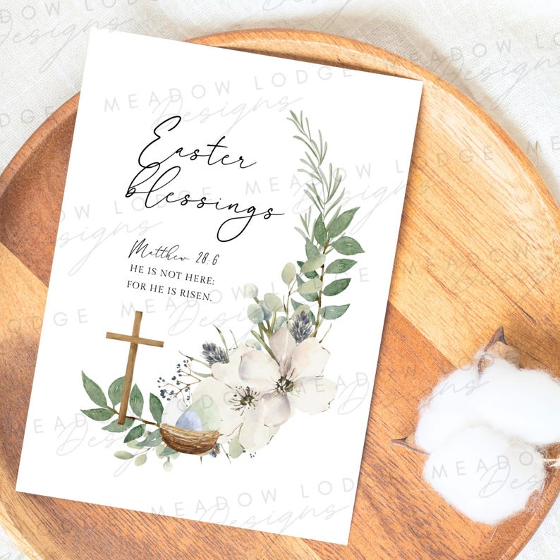 May include: A white card with a watercolor floral wreath and a cross. The text reads "Easter Blessings" and "Matthew 28:6 He is not here: for he is risen."
