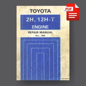Puede incluir: Un manual de reparación vintage para el motor Toyota 2H, 12H-T con un diseño azul y blanco. El manual está fechado en noviembre de 1985 y tiene el número de publicación RMC:28.