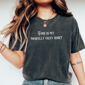 May include: A dark gray t-shirt with the text "This is my morally gray shirt" printed in white.