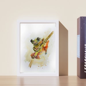 May include: A watercolour painting of a green tree frog sitting on a branch. The frog has orange feet and is surrounded by a light yellow background.