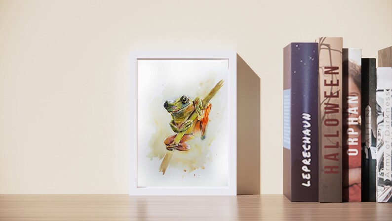 May include: A watercolour painting of a green tree frog sitting on a branch. The frog has orange feet and is surrounded by a light yellow background.