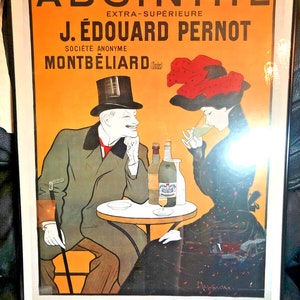 Puede incluir: Póster vintage que anuncia Absinthe Extra-Supérieure J. Édouard Pernod, una Société Anonyme en Montbéliard (Doubs). El póster presenta a un hombre y una mujer sentados a una mesa con botellas de absenta y vasos. El póster está en un marco negro.