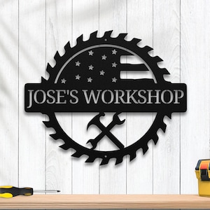 May include: Black metal sign with a saw blade design, an American flag, and the text "JOSE'S WORKSHOP".