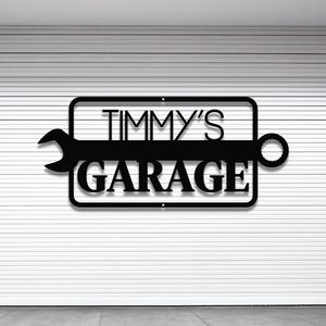 May include: Black metal sign with a wrench design and the text "TIMMY'S GARAGE" in white letters.
