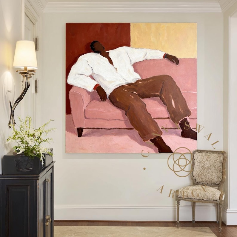 May include: An abstract painting depicts a person reclining on a pink sofa. The figure wears a white shirt and brown pants. The background features a red and yellow color block design. A decorative chair and a black cabinet are in the foreground.