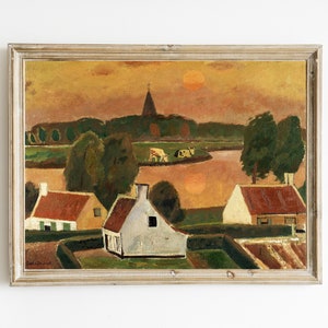 May include: A painting depicting a rural landscape with a church steeple in the distance, a river, and several houses. The sky is a vibrant orange and yellow, with a large sun in the upper right corner. The painting is framed in a light wood frame.