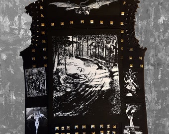 May include: Black denim vest with gold-colored studs and patches. The vest features a large black and white forest scene on the back, along with other graphic patches and a winged dragon design.