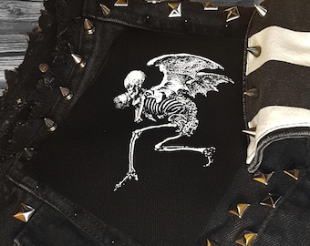 The winged skeleton of Death flies off with a baby 1792 screen printed patch Horror Punk Black metal Goth lore