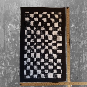 May include: Black and white checkered fabric patch with a rough, hand-painted texture. The patch is approximately 12 inches by 18 inches.