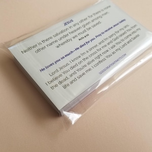 Jesus gospel tracts — Acts 4:12 Christian scripture cards with salvation prayer; sealed 25-pack showing back text in clear resealable cellophane bag on neutral background; 25–250 options.