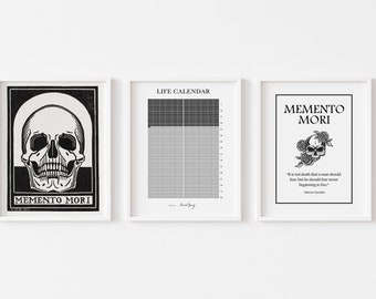 May include: Three black and white framed prints with the text "Memento Mori" and skull imagery. The middle print is a life calendar with a grid of squares.