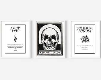 May include: Three black and white framed prints with Latin phrases and illustrations. The first print says "Amor Fati" with a flame illustration. The second print says "Memento Mori" with a skull illustration. The third print says "Summum Bonum" with a rose illustration.