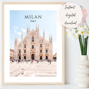 May include: A printable digital download of a photograph of the Duomo di Milano, the main cathedral in Milan, Italy. The photo shows the facade of the cathedral with a crowd of people in the square in front of it. The text "MILAN ITALY" is at the top of the image.