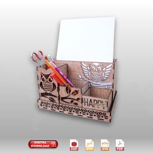 May include: Wooden desk organizer with owl cutouts and the word "HAPPY" on the front. It has compartments for pens, pencils, and other office supplies.
