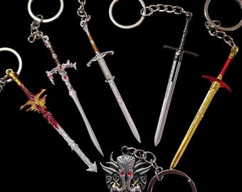 May include: A set of seven silver and red sword keychains with intricate details. The keychains feature different sword designs, including a curved sword, a straight sword, and a sword with a dragon head. The keychains are attached to silver rings.