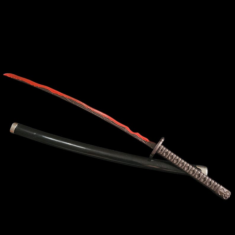 May include: A katana sword with a red blade and a black scabbard. The blade has a unique pattern and the handle is wrapped with a textured grip. The sword is set against a black background.