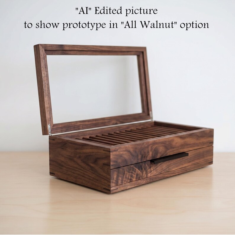 May include: A rectangular dark brown walnut wood storage box with a hinged glass lid and a pull-out drawer featuring a thin black handle. The interior contains multiple parallel slots. Text above reads: "AI" Edited picture to show prototype in "All Walnut" option.