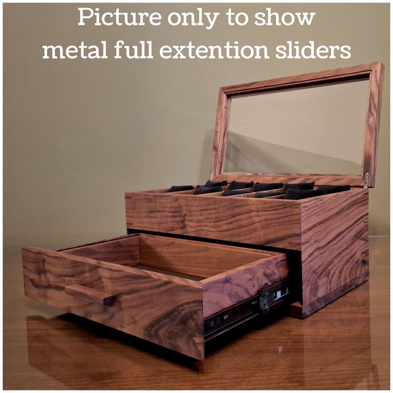May include: A wooden storage box with a hinged glass lid and a pull-out drawer featuring metal full extension sliders. The box has a visible wood grain pattern and includes internal compartments with black inserts. Text reads: Picture only to show metal full extention sliders.