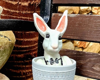 Charming clay pot adornment featuring a delightful plaster rabbit, perfect for enhancing both garden and home décor.  rabbit size  5.2"*8.6"