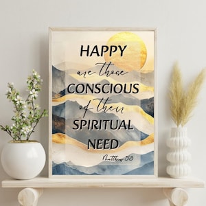 Peut inclure: Une affiche encadrée avec un paysage de montagnes et un soleil doré. Le texte dit "HAPPY are those CONSCIOUS of their SPIRITUAL NEED" avec "Matthew 5:3" en dessous. L'œuvre est exposée sur une étagère blanche.