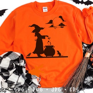 May include: Bright orange sweatshirt featuring a black silhouette of a witch stirring a cauldron under a full moon. A crow and a mouse are also depicted. The design is perfect for Halloween. The bottom of the sweatshirt has the words "California Drama Design" and the file types: SVG, PNG, JPG, EPS.