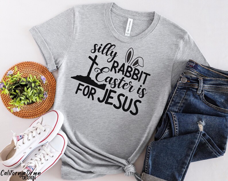 May include: Gray t-shirt with a black graphic that says "silly rabbit easter is for jesus" with a cross and bunny ears.