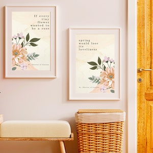 May include: Two framed floral prints with inspirational quotes. The first print features a quote by St. Thérèse of Lisieux: "If every tiny flower wanted to be a rose, spring would lose its loveliness." The second print features a quote by St. Thérèse of Lisieux: "If every tiny flower wanted to be a rose, spring would lose its loveliness."