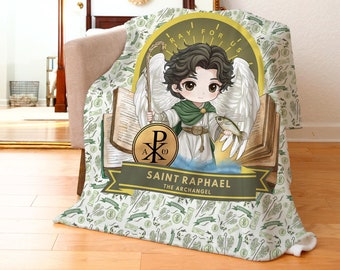 May include: A green and gold throw blanket with a cartoon image of Saint Raphael the Archangel. The image features a young man with brown hair and blue eyes, holding a staff and a fish. The text "I Pray For Us" is written above the image, and "Saint Raphael The Archangel" is written below the image.