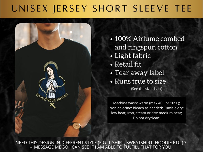 May include: Black short-sleeved t-shirt with a graphic of the Virgin Mary and the text "Behold Your Mother". The t-shirt is made of 100% Airlume combed and ringspun cotton. It has a light fabric, retail fit, tear away label, and runs true to size.