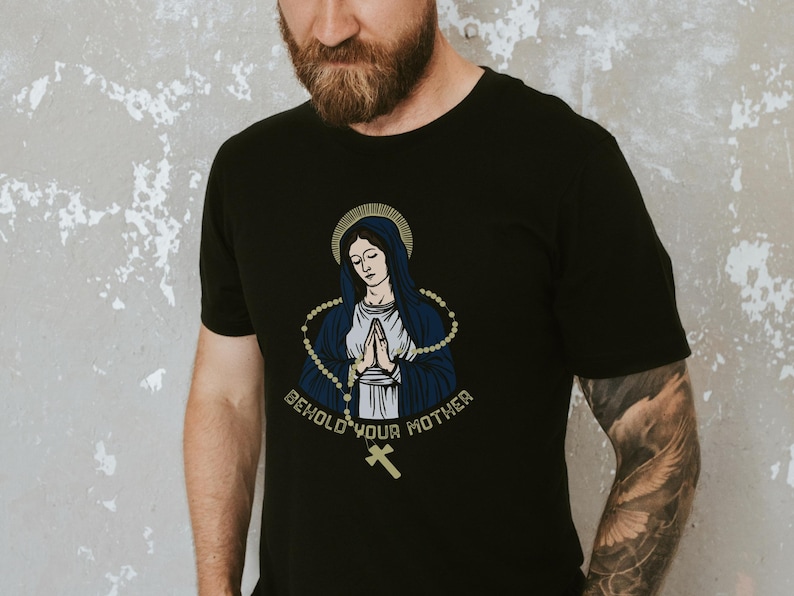 May include: Black t-shirt with a graphic of the Virgin Mary with a rosary and the text "Behold Your Mother".