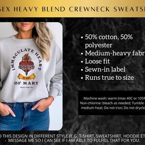 May include: Gray unisex crewneck sweatshirt with a graphic of the Immaculate Heart of Mary. The graphic features a heart with a sword, roses, and the text "Ave Maria" and "Pray for Us!".