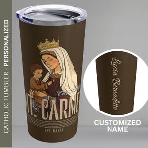 May include: A brown stainless steel tumbler featuring a graphic of Our Lady of Mount Carmel holding a baby. The tumbler has a white lid and a personalised name on the side. The text on the tumbler reads "Our Lady of Mount Carmel, Ave Maria".